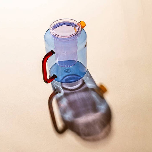 Blue teapot with red handle and orange spout